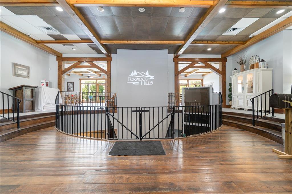 Image 4: The spacious foyer welcomes with rustic wooden bea