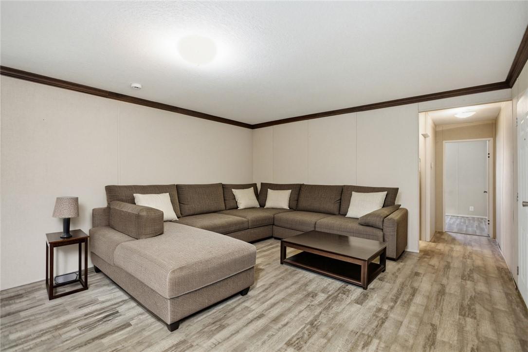 Image 4: This inviting living space features durable floori