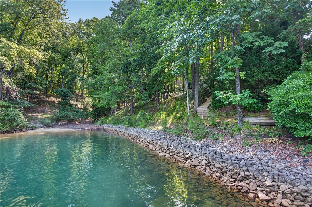 Image 3: A natural sand beach at the end of the private cov