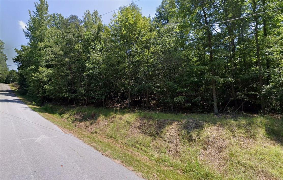 Image 1: A secluded wooded parcel offers a prime location f