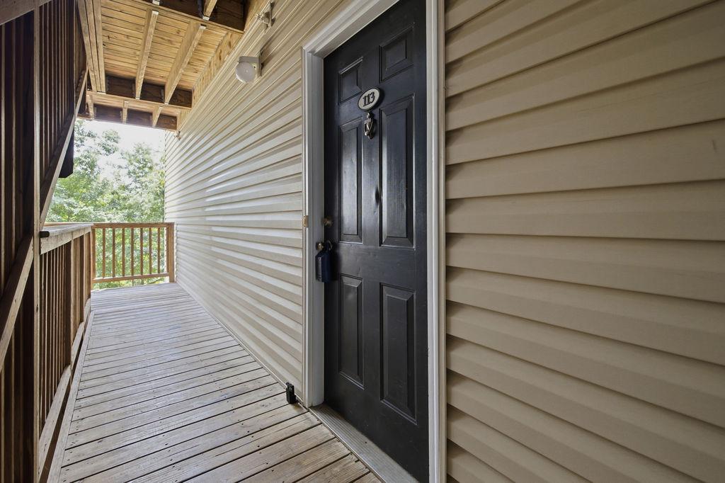 Image 2: A welcoming entry beckons with a classic black doo