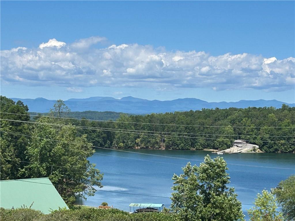 Image 2: Scenic lake vistas with distant mountains create a