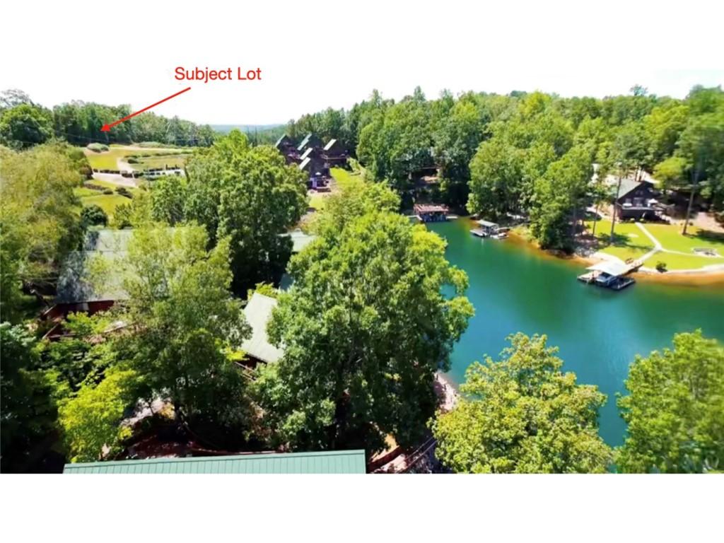 Image 3: A prime building site awaits, boasting scenic lake