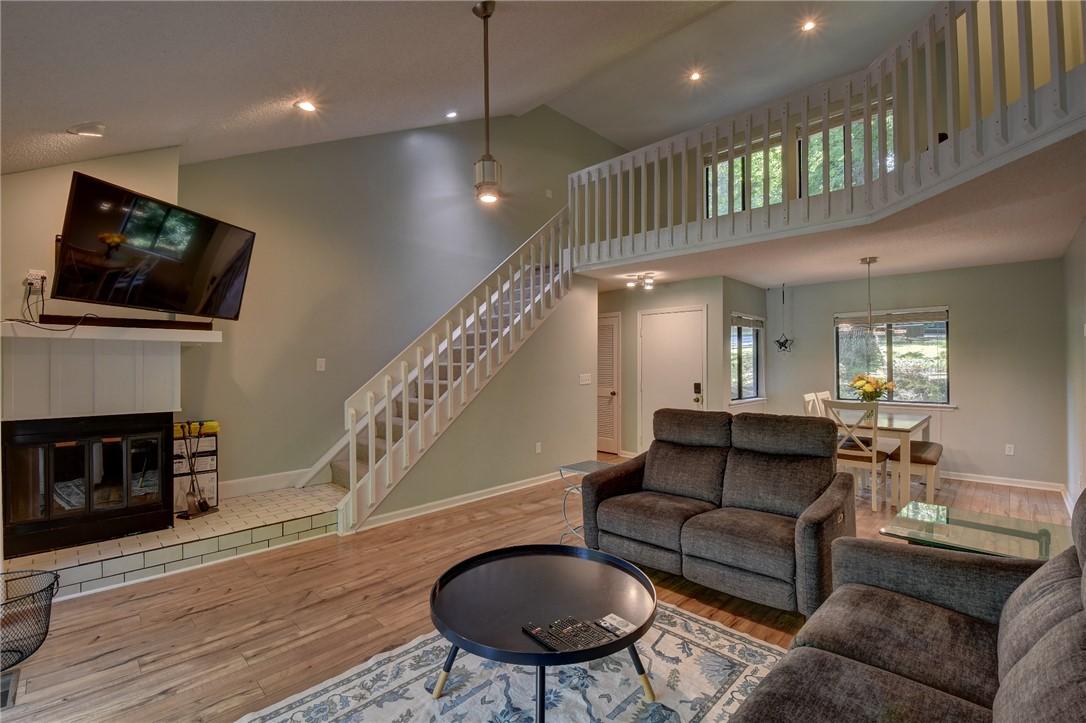 Image 4: A split-level layout with a light-filled dining ar