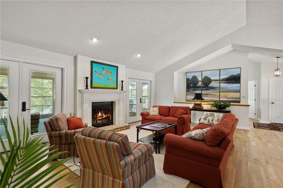 Image 3: A comforting gas logs fireplace serves as the hear