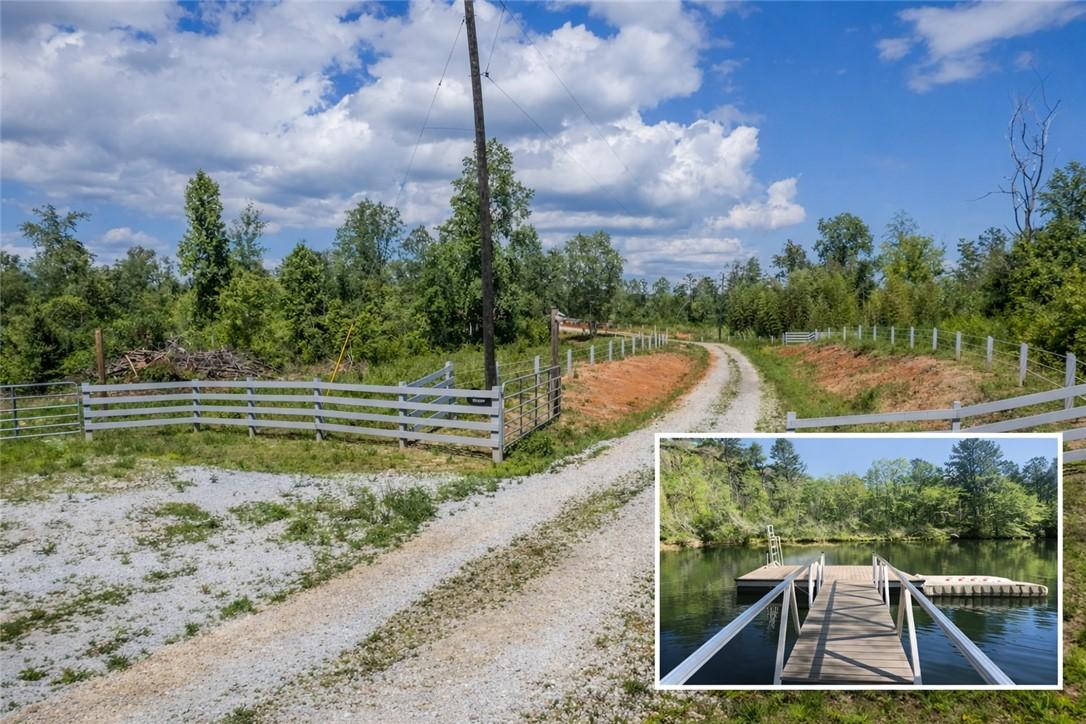 Image 1: This scenic property features a private gravel dri