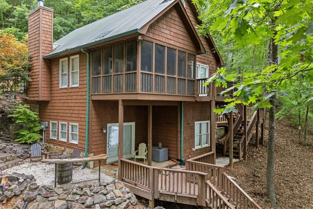 Image 1: A tranquil woodland retreat, this home features a