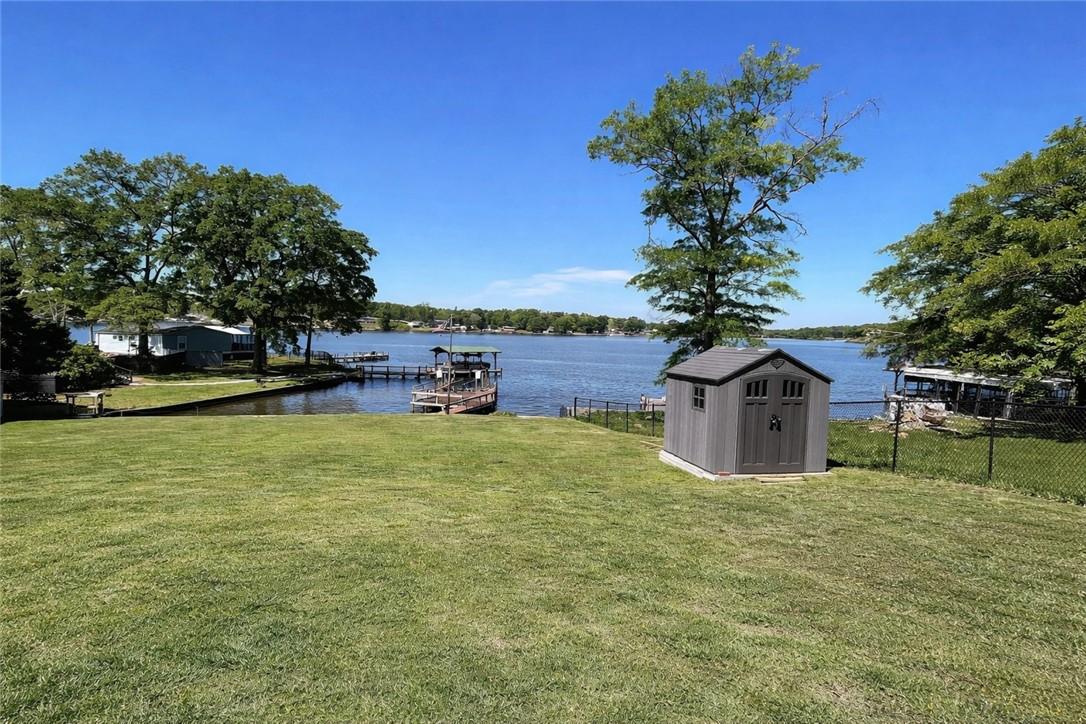 Image 2: This tranquil waterfront property offers expansive