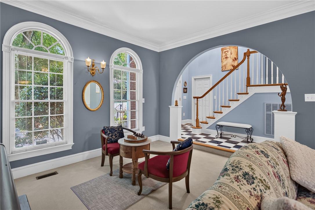 Image 3: Ornate arched windows complement a checkerboard ti