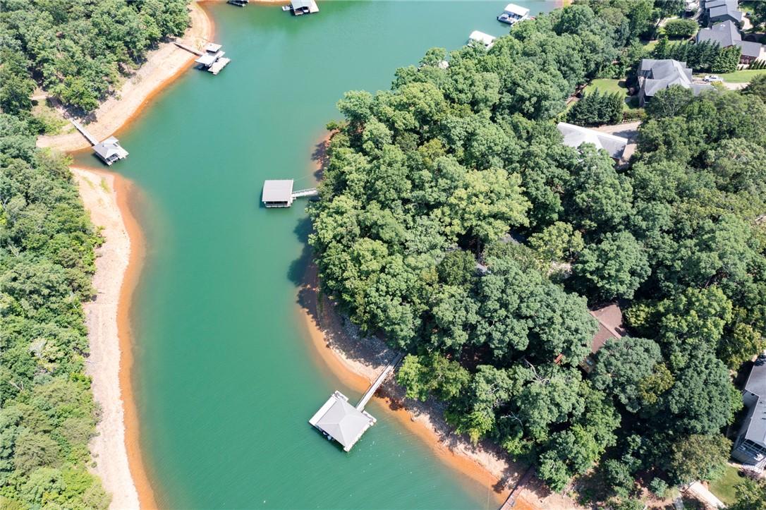 Image 3: A tranquil lakefront property featuring private bo