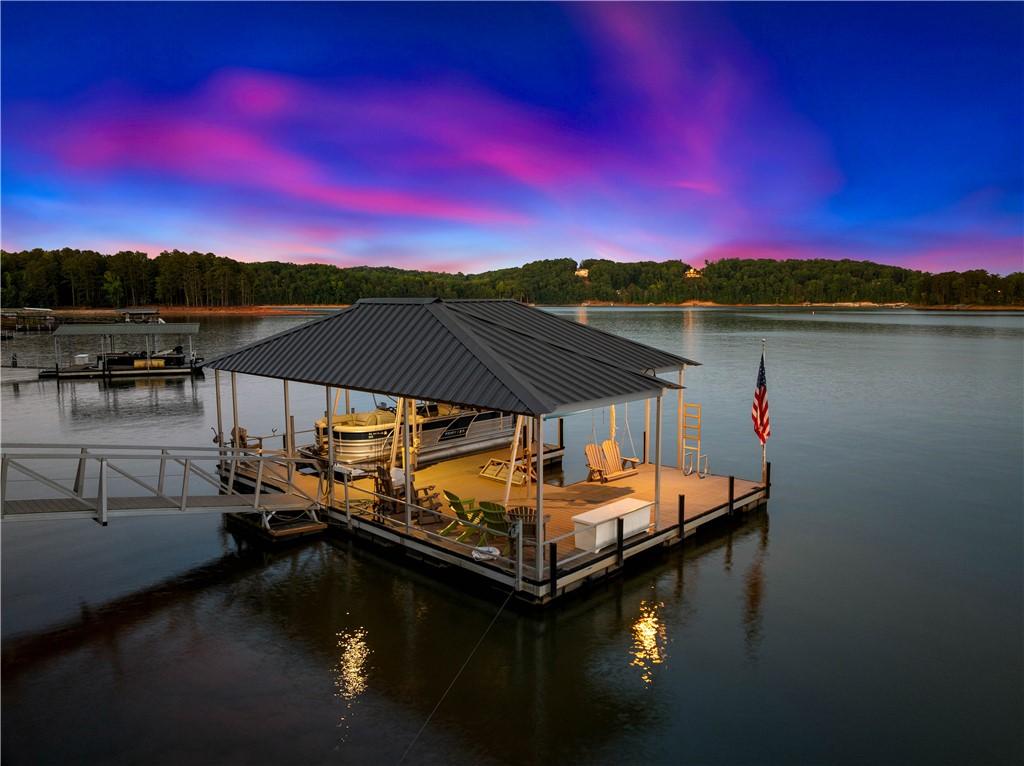 Image 2: A private covered dock with boat slip, providing d
