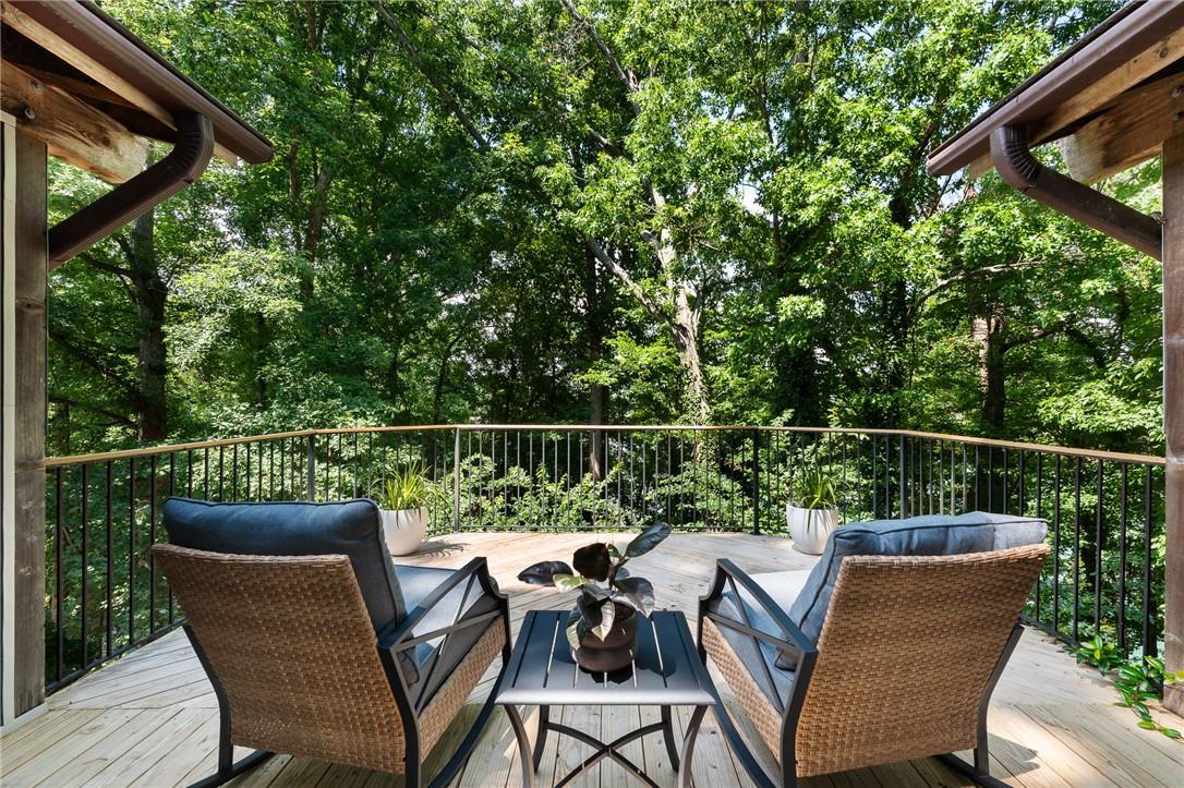 Image 2: An inviting deck offers a serene, elevated view of