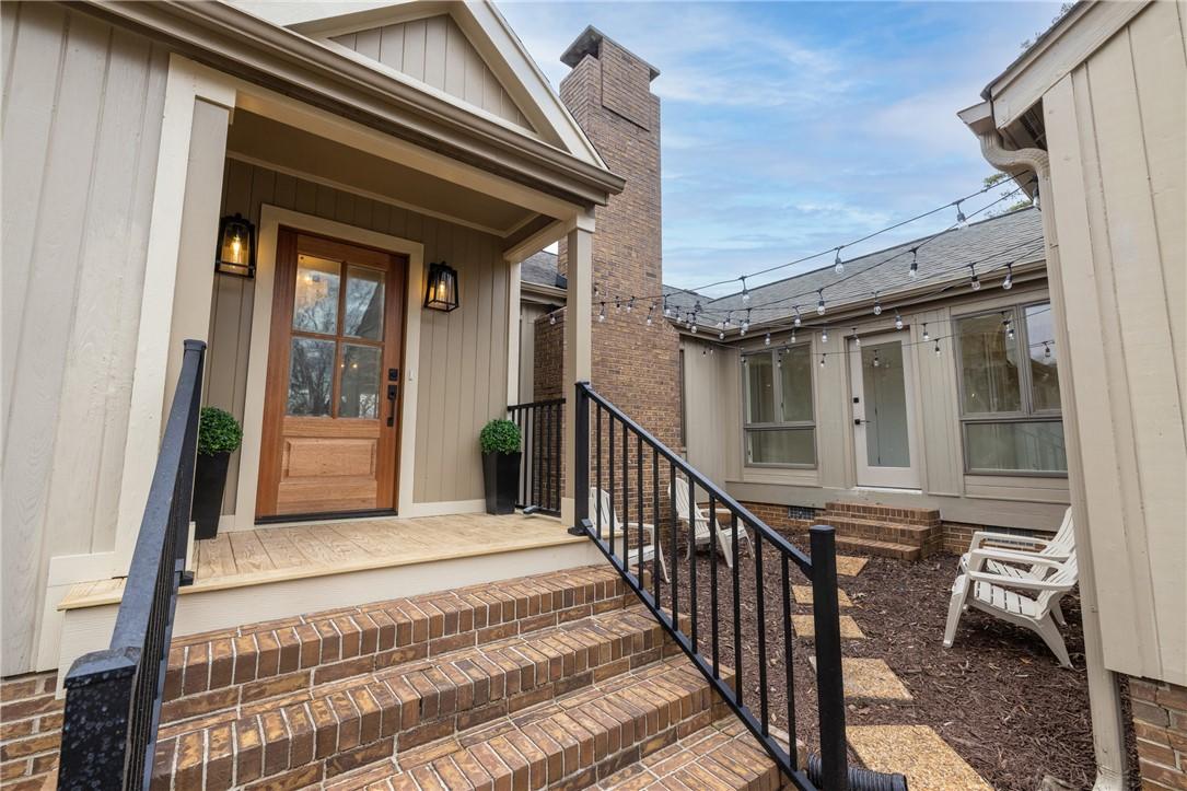 Image 2: This charming home welcomes you with a classic bri