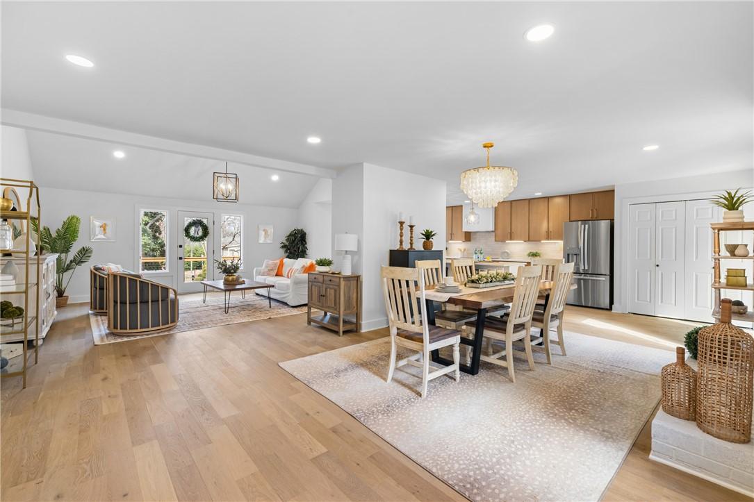 Image 4: Bright and airy open-concept living space perfect