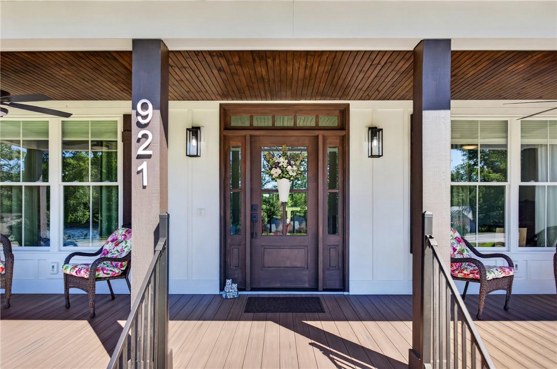 Image 2: Welcome guests to a charming front porch, featurin