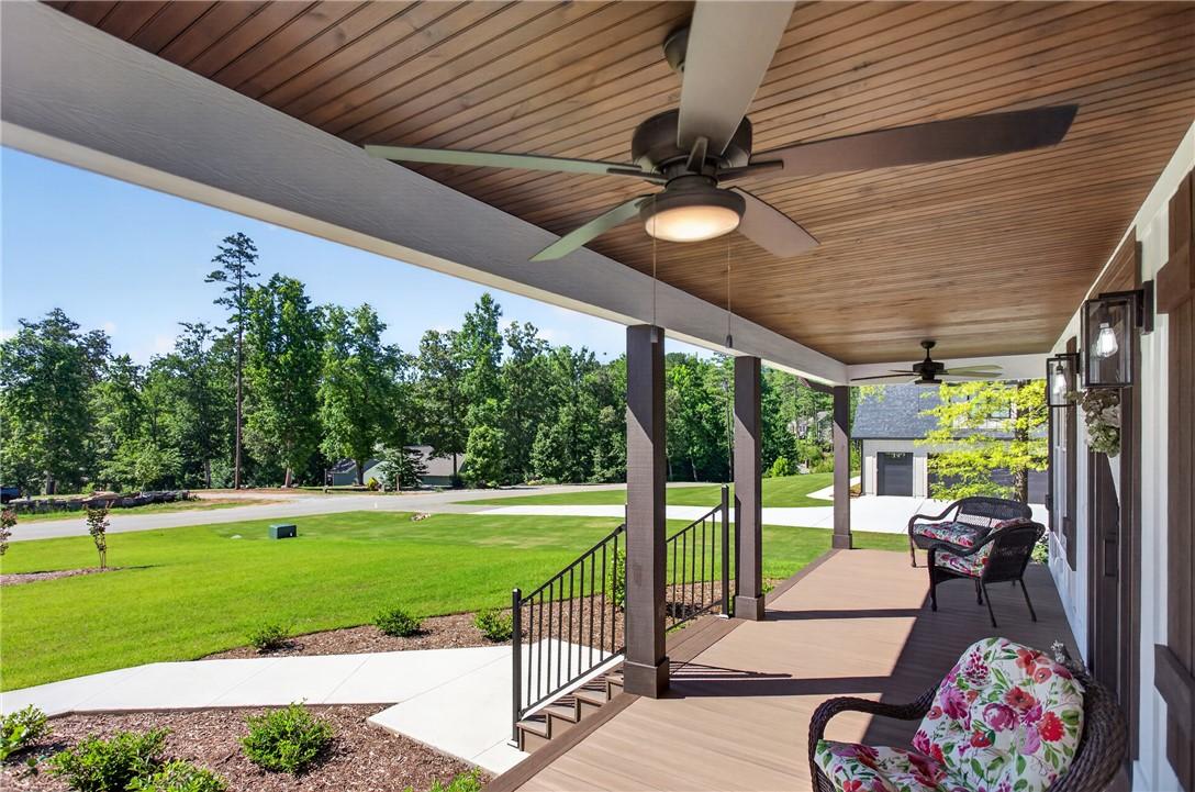 Image 3: Relax on this grand covered porch, offering expans