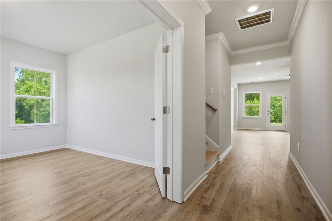 Image 4: Natural light floods this room, highlighting the w