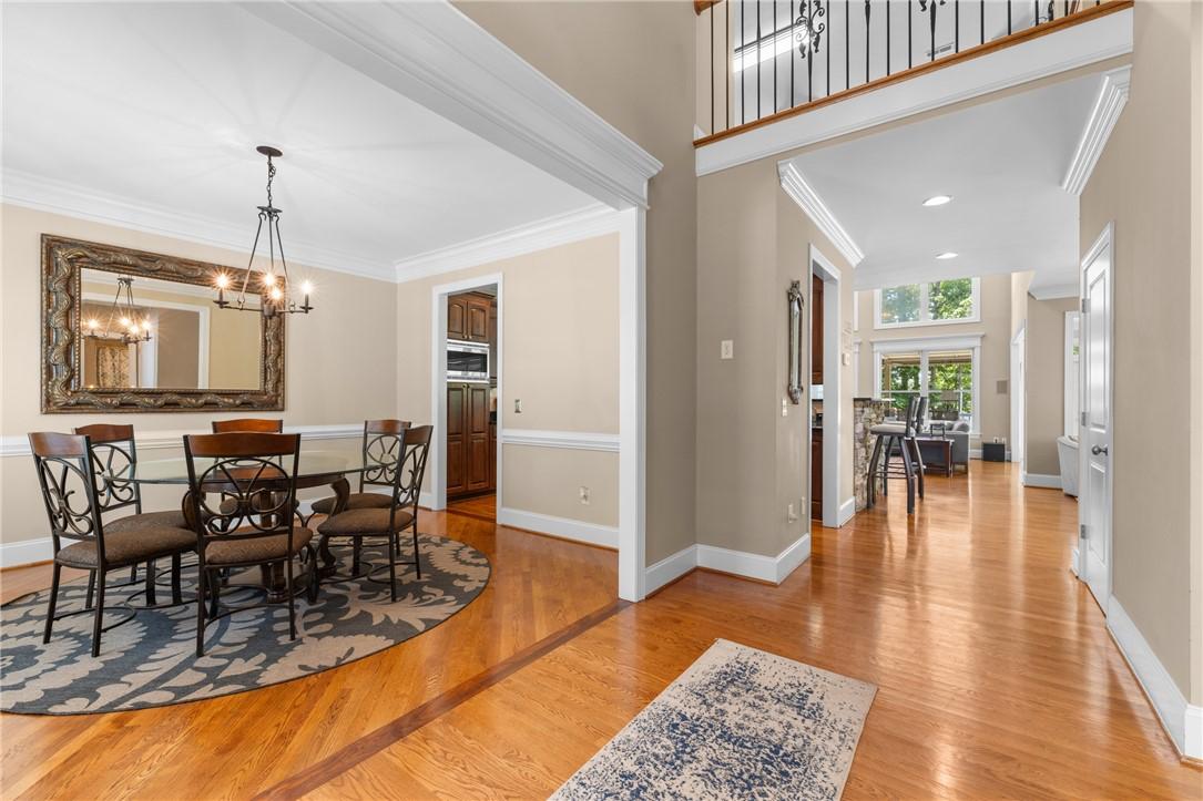 Image 4: Hardwood flooring extends throughout this formal d
