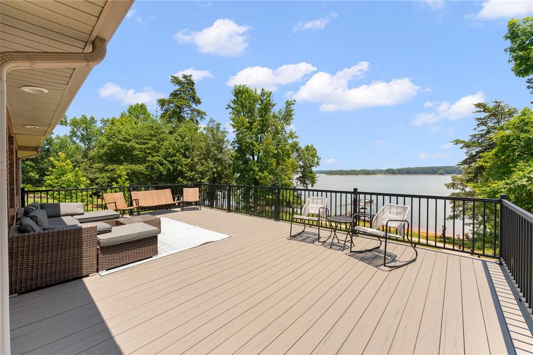 Image 2: Lakeside living beckons from this expansive deck,