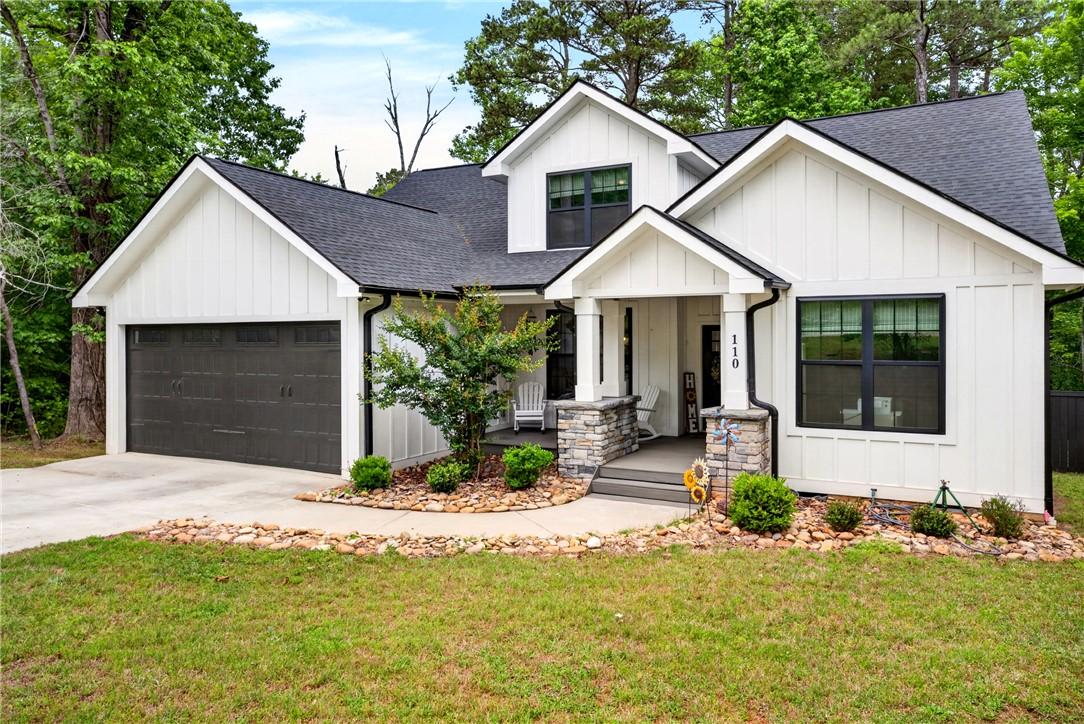 Image 4: This inviting home presents a striking facade with