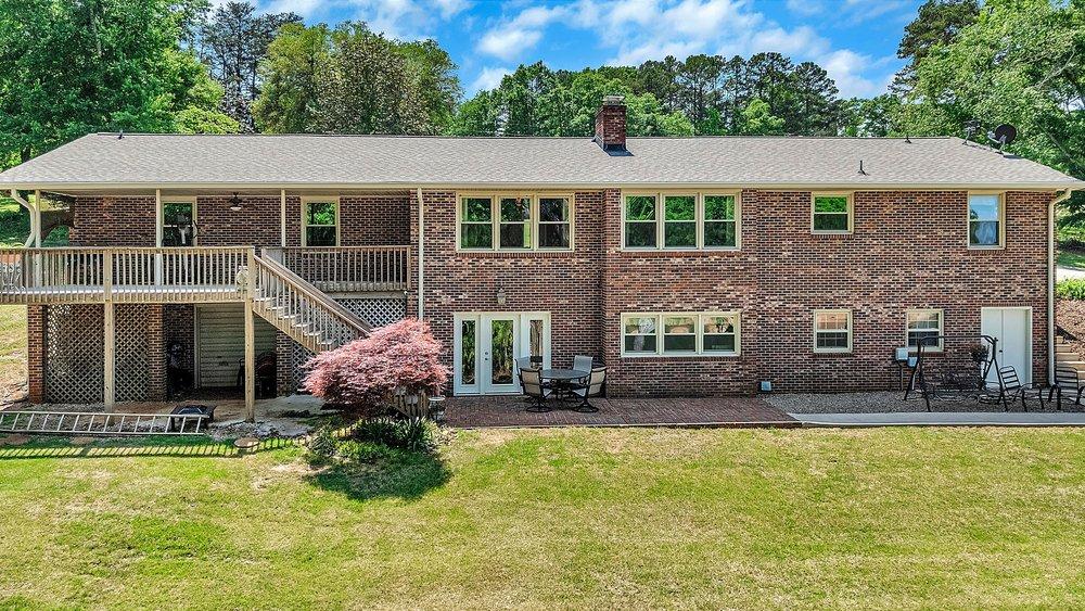 Image 3: This residence showcases a large brick exterior, a