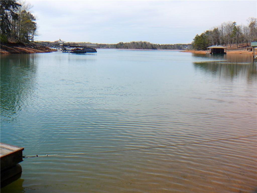 Image 2: This tranquil waterfront setting offers serene lak