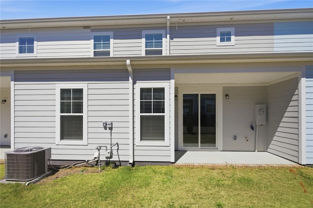 Image 4: This residence features a comfortable patio with a