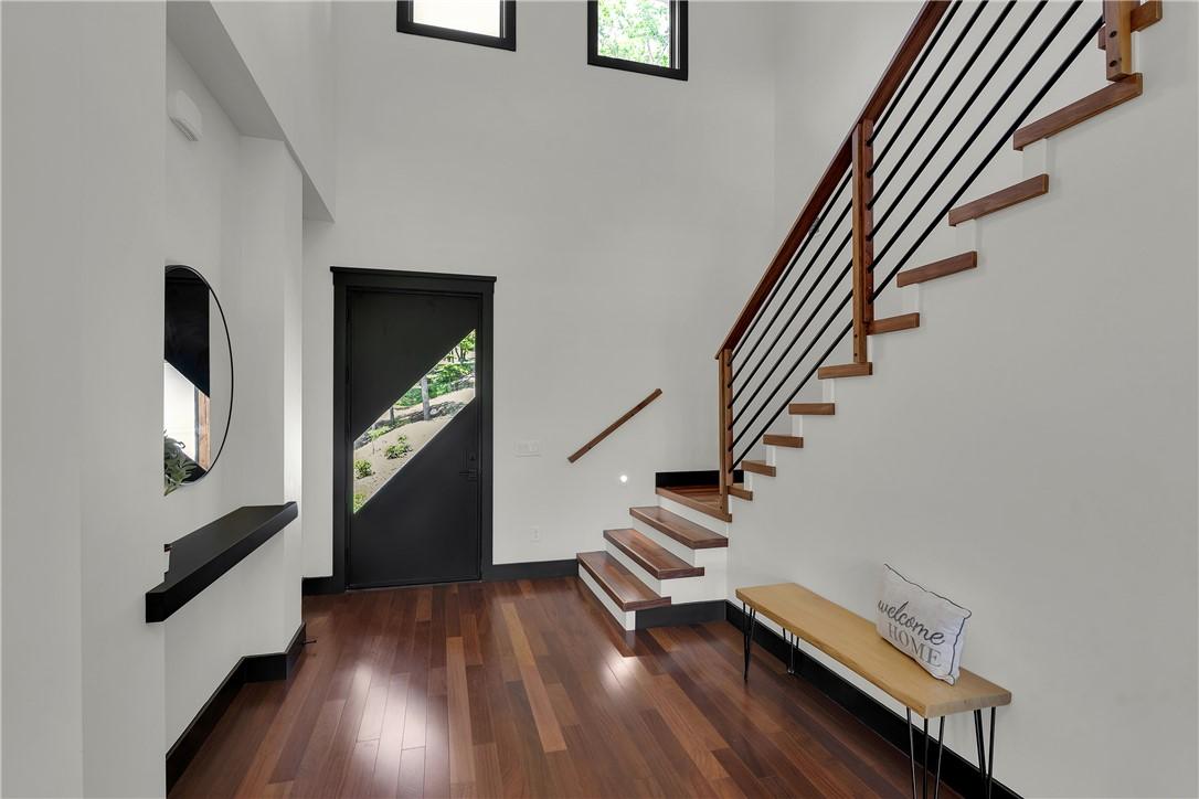 Image 4: Clean lines and warm wood flooring define this con