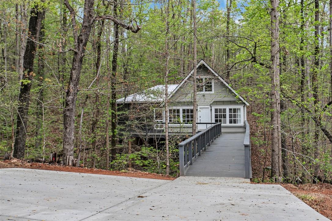 Image 2: A charming forest retreat accessed by a welcoming