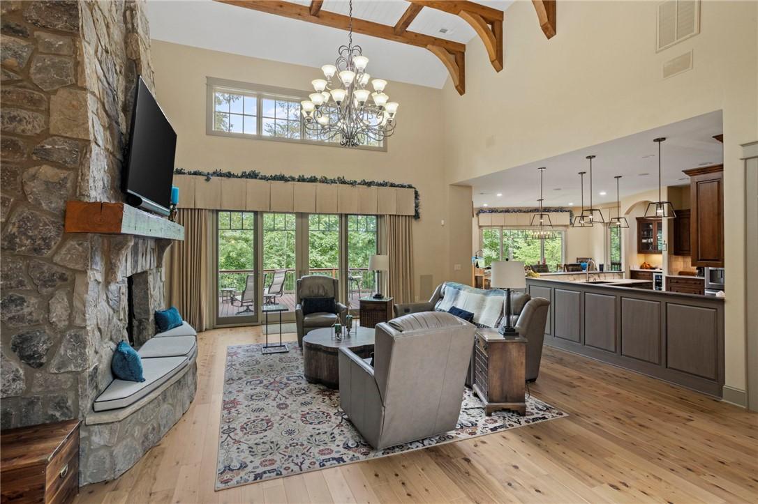 Image 4: A spacious living area featuring soaring ceilings,