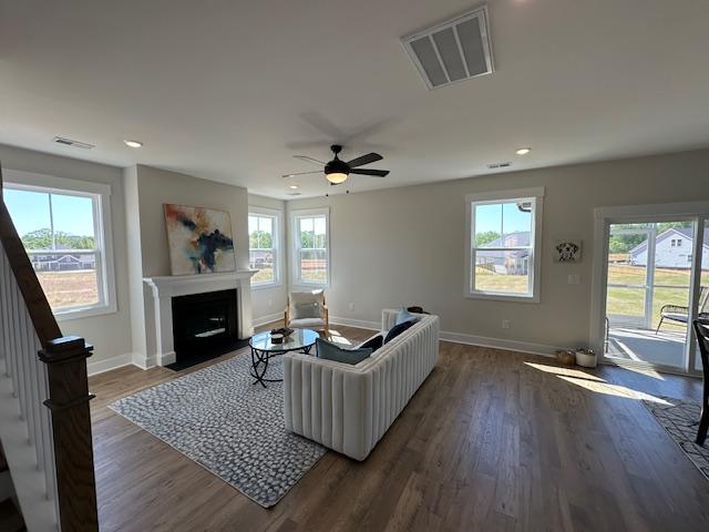 Image 4: This living room features a fireplace and a seamle