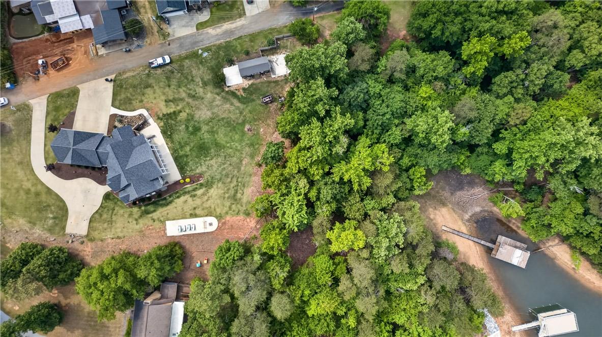 Image 4: An aerial perspective reveals a private waterfront