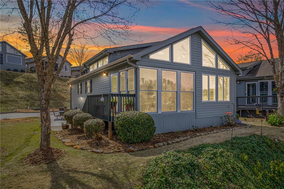 Image 2: This charming home features a lovely outdoor space
