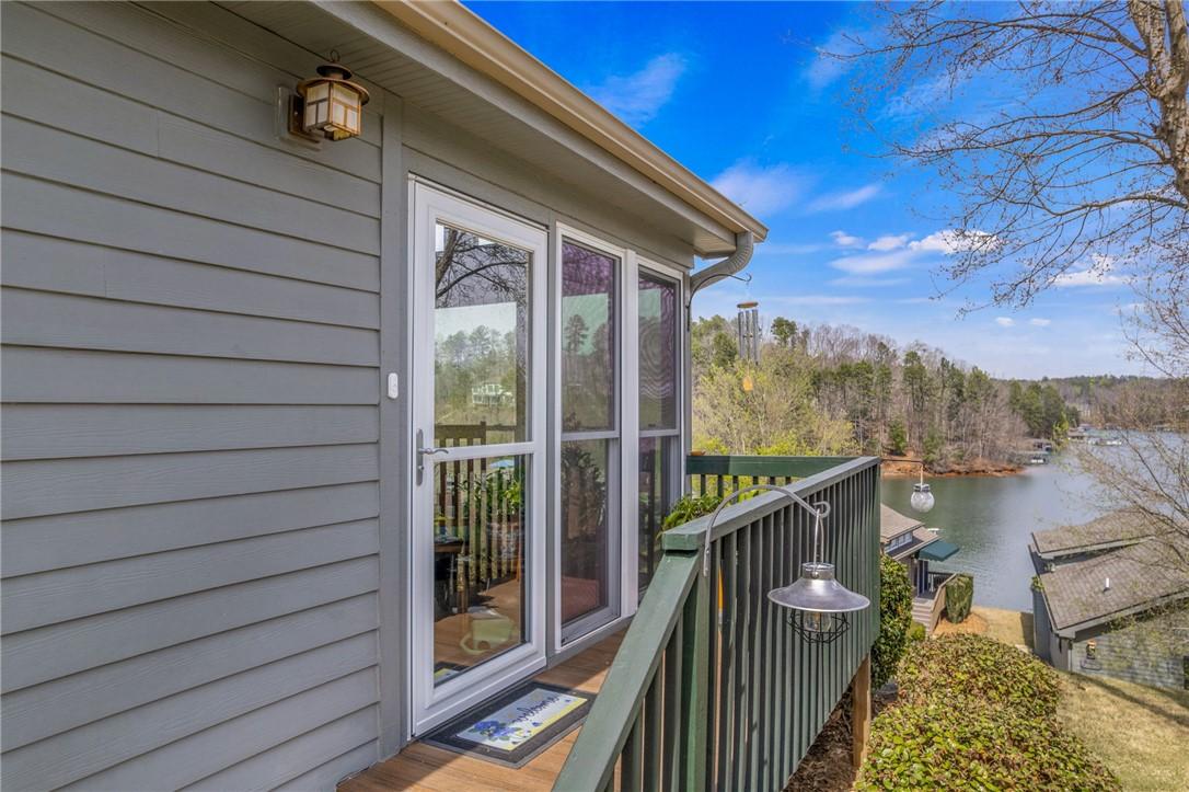 Image 4: This tranquil porch offers serene outdoor living w