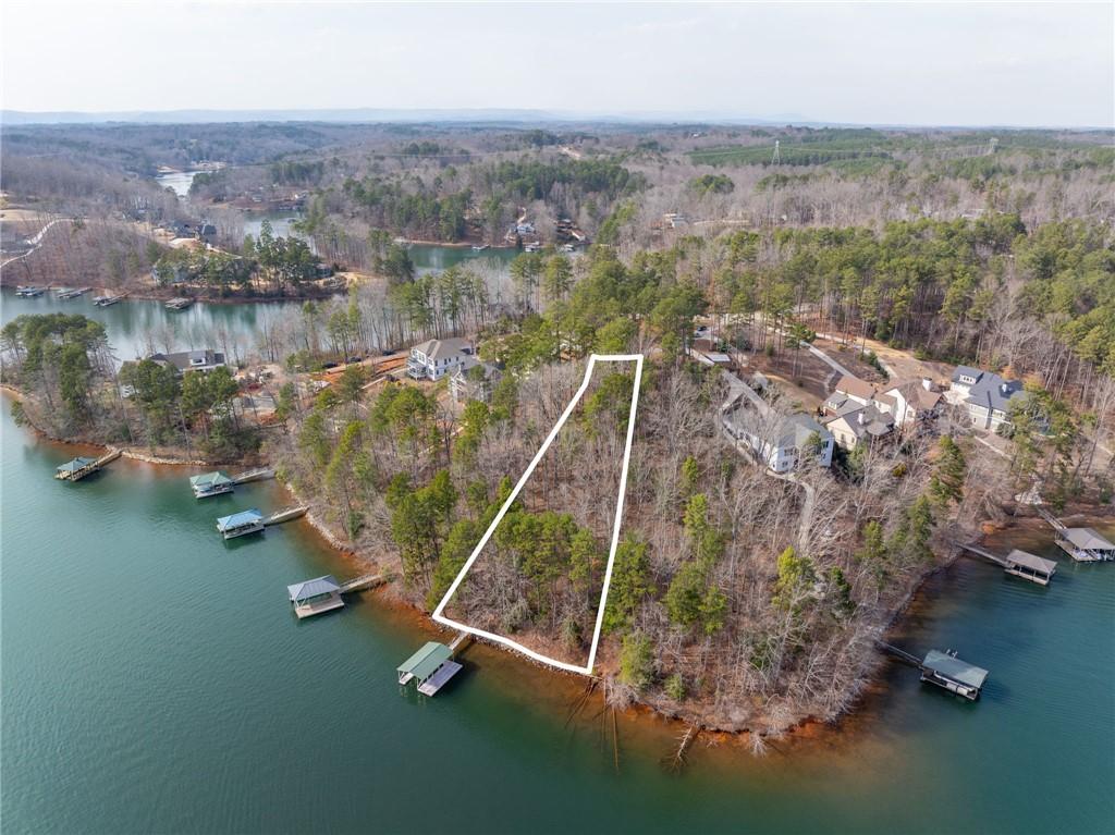 Image 3: This serene waterfront lot offers exceptional view