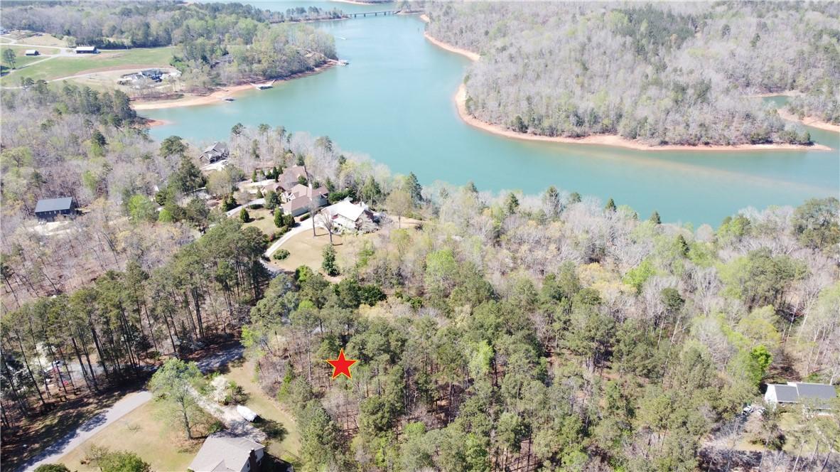 Image 4: This elevated view captures a serene landscape wit
