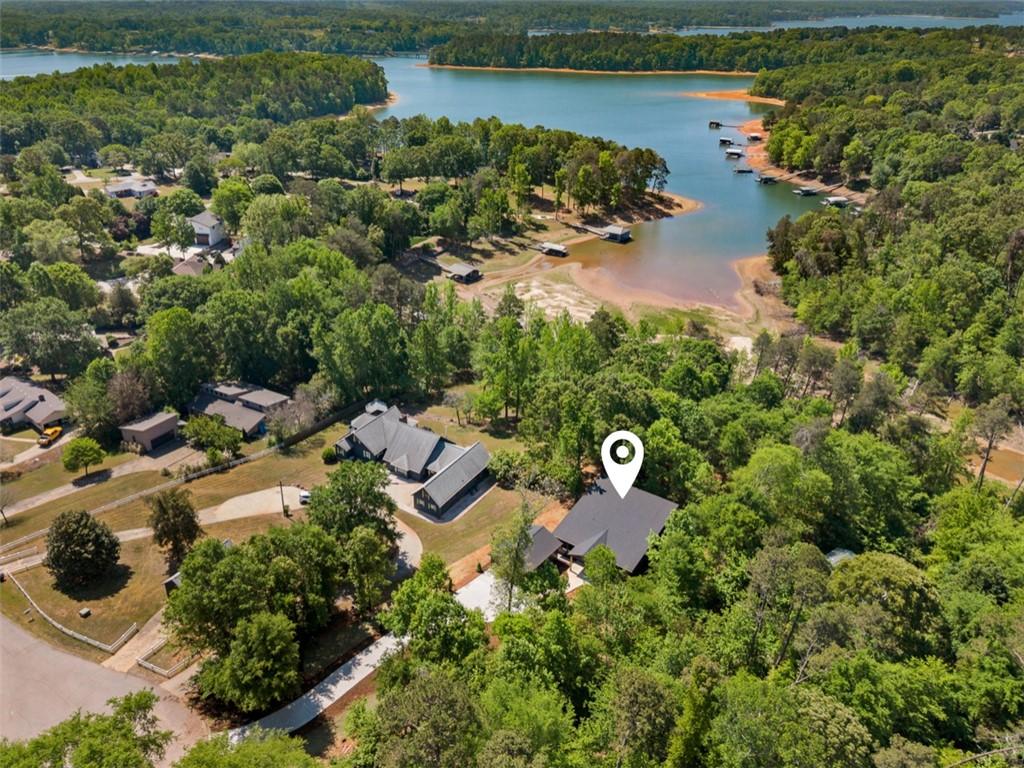 Image 2: Perched among lush trees, this property offers ser