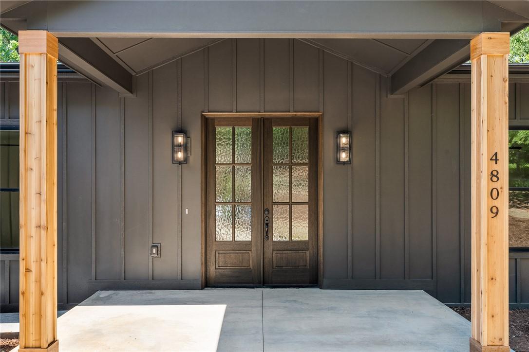 Image 4: Enter this charming residence through beautiful do