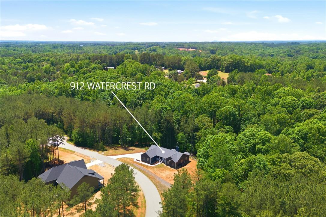 Image 3: An aerial perspective reveals a secluded residence
