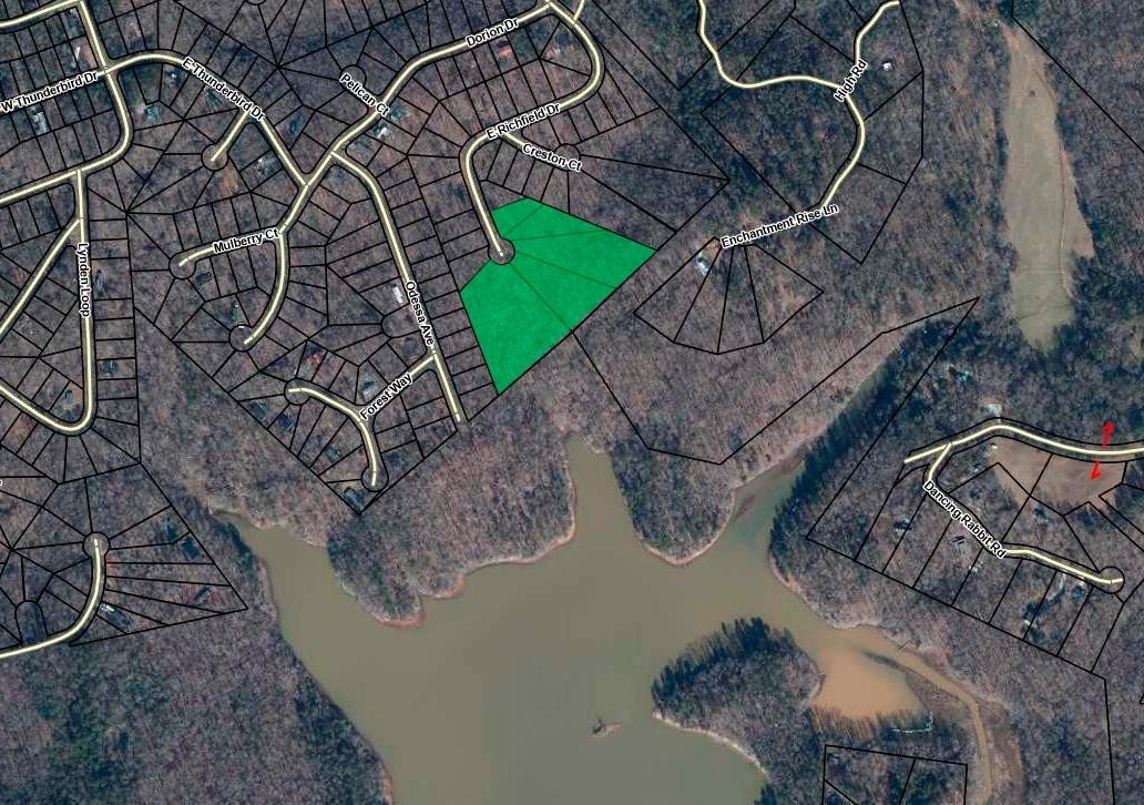 Image 1: This aerial view showcases a desirable lot within