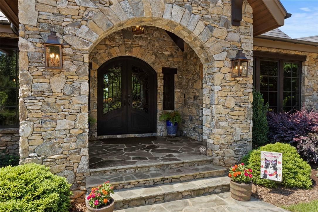 Image 2: A grand arched stone entryway welcomes all with in