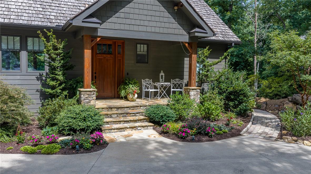 Image 1: A welcoming front entrance featuring natural wood