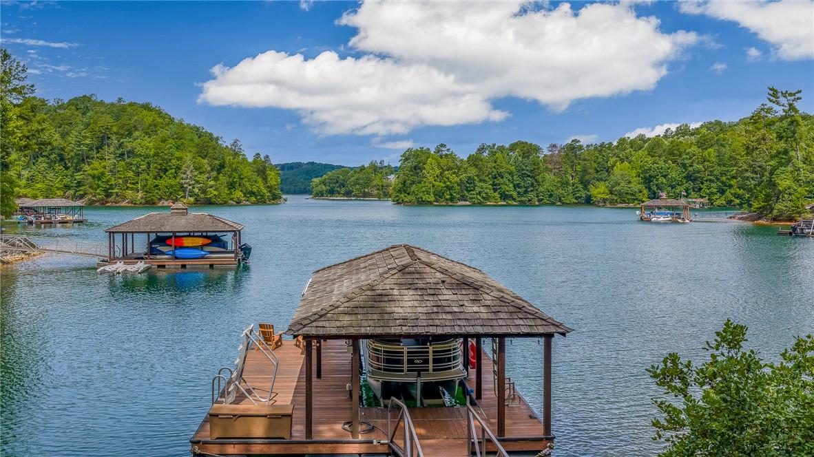 Image 2: Boathouses with private docks extend into the clea