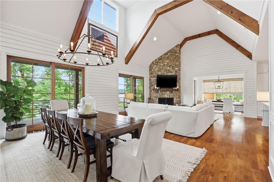 Image 3: An open-concept living area with vaulted ceilings