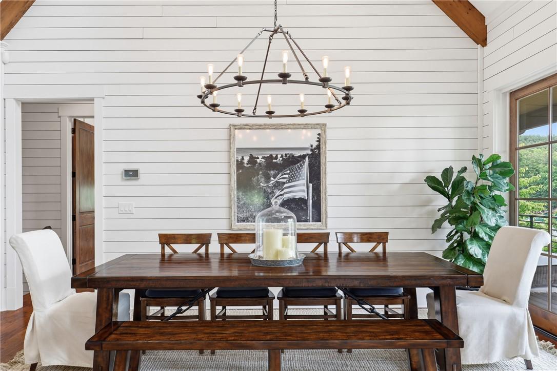 Image 4: A striking chandelier illuminates this inviting di