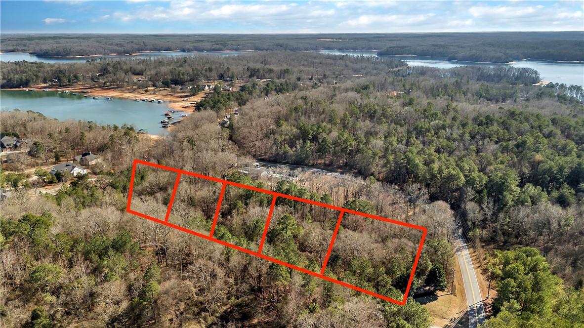 Image 4: This expansive, wooded property offers serene wate