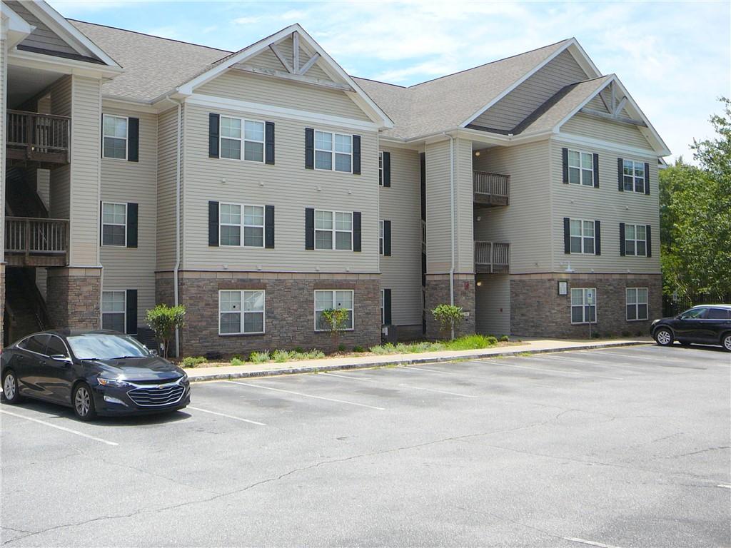 Image 1: A multi-story residential building features varied