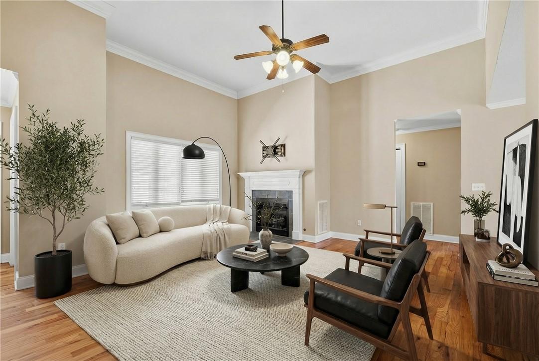 Image 3: This inviting living room features a fireplace and