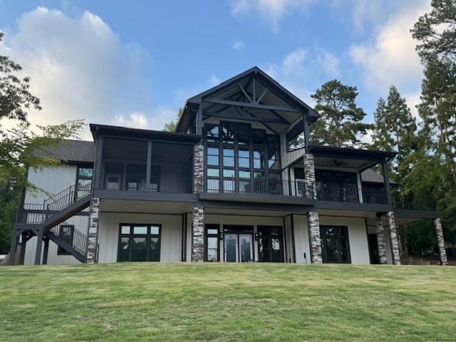 Image 3: A striking craftsman home featuring covered balcon