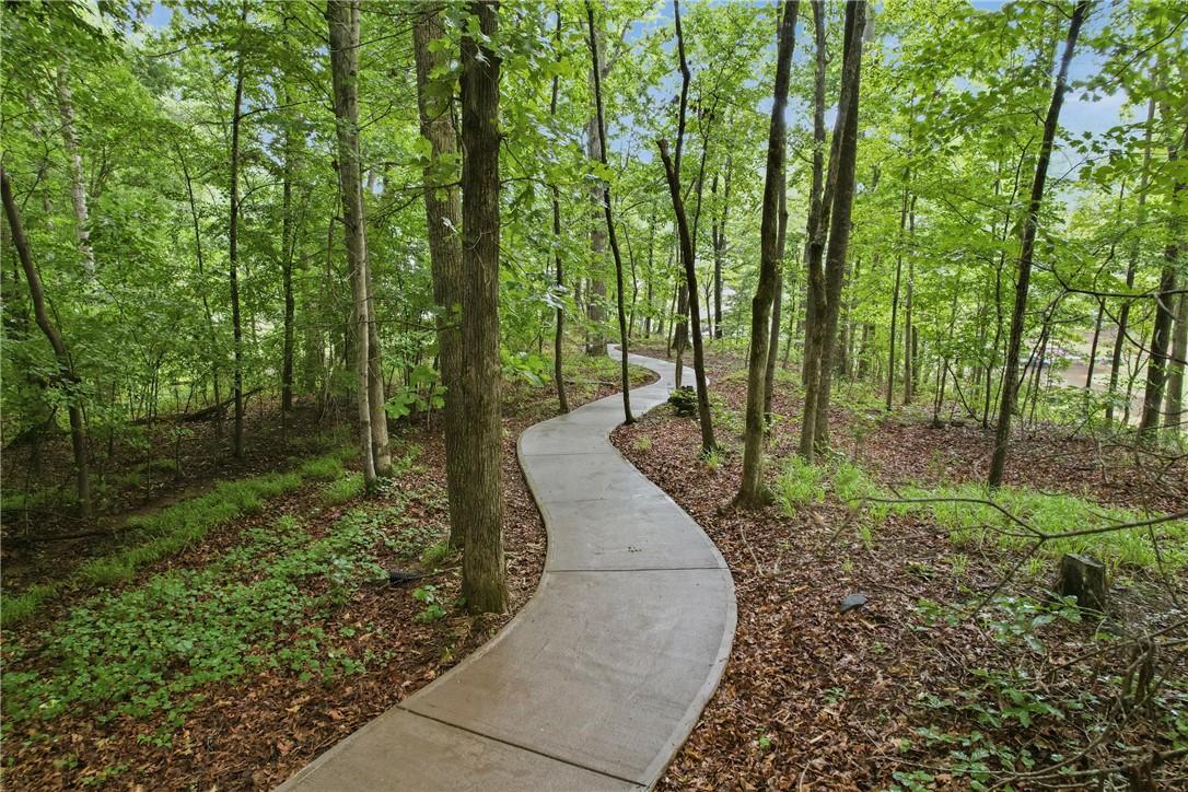 Image 4: New stained concrete golf cart path leads all the